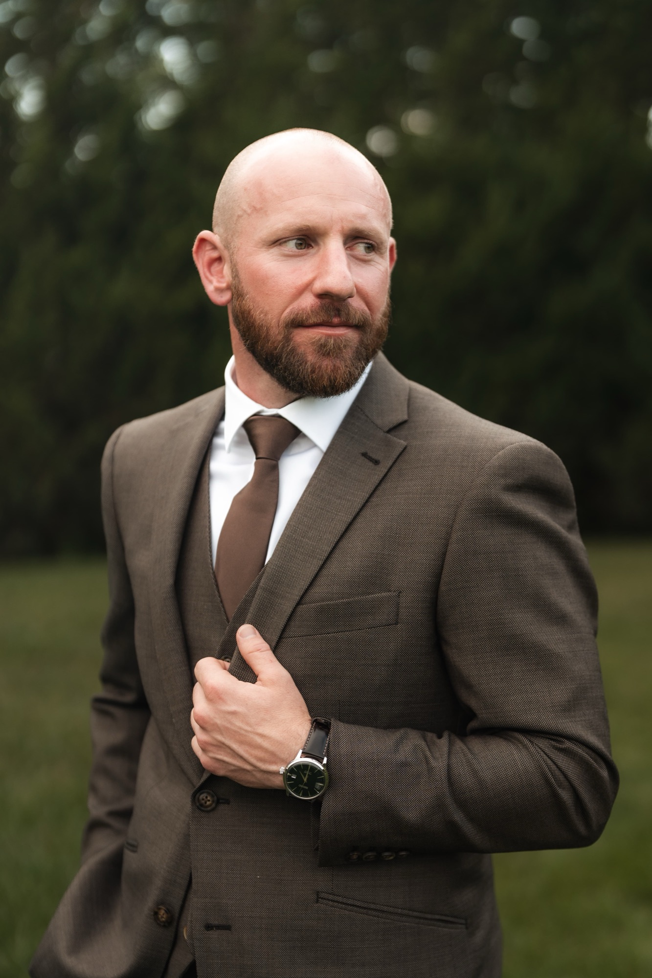Groom portrait in a brown suit