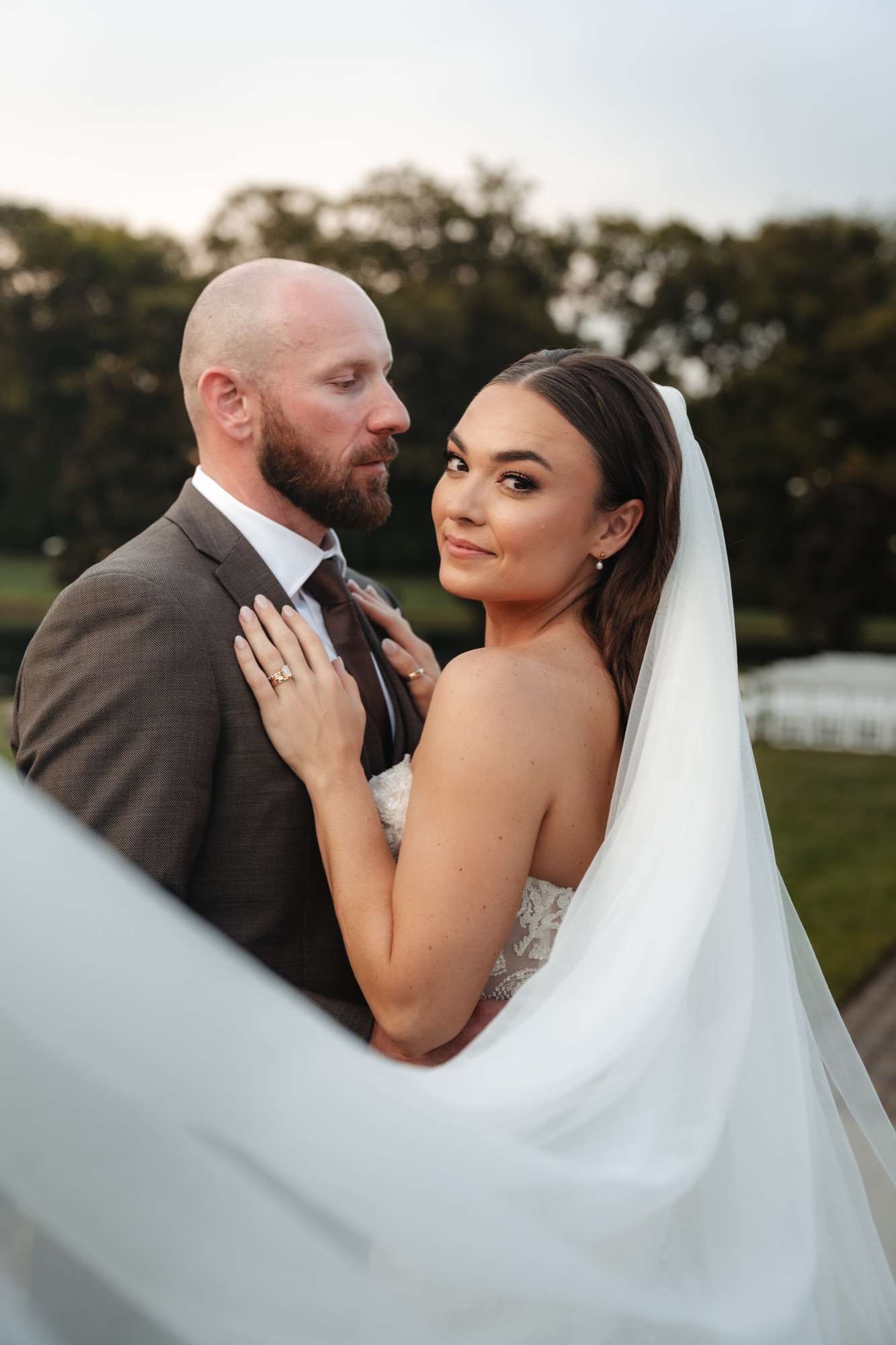 Bride beneath her veil at golden hour, Nashville wedding