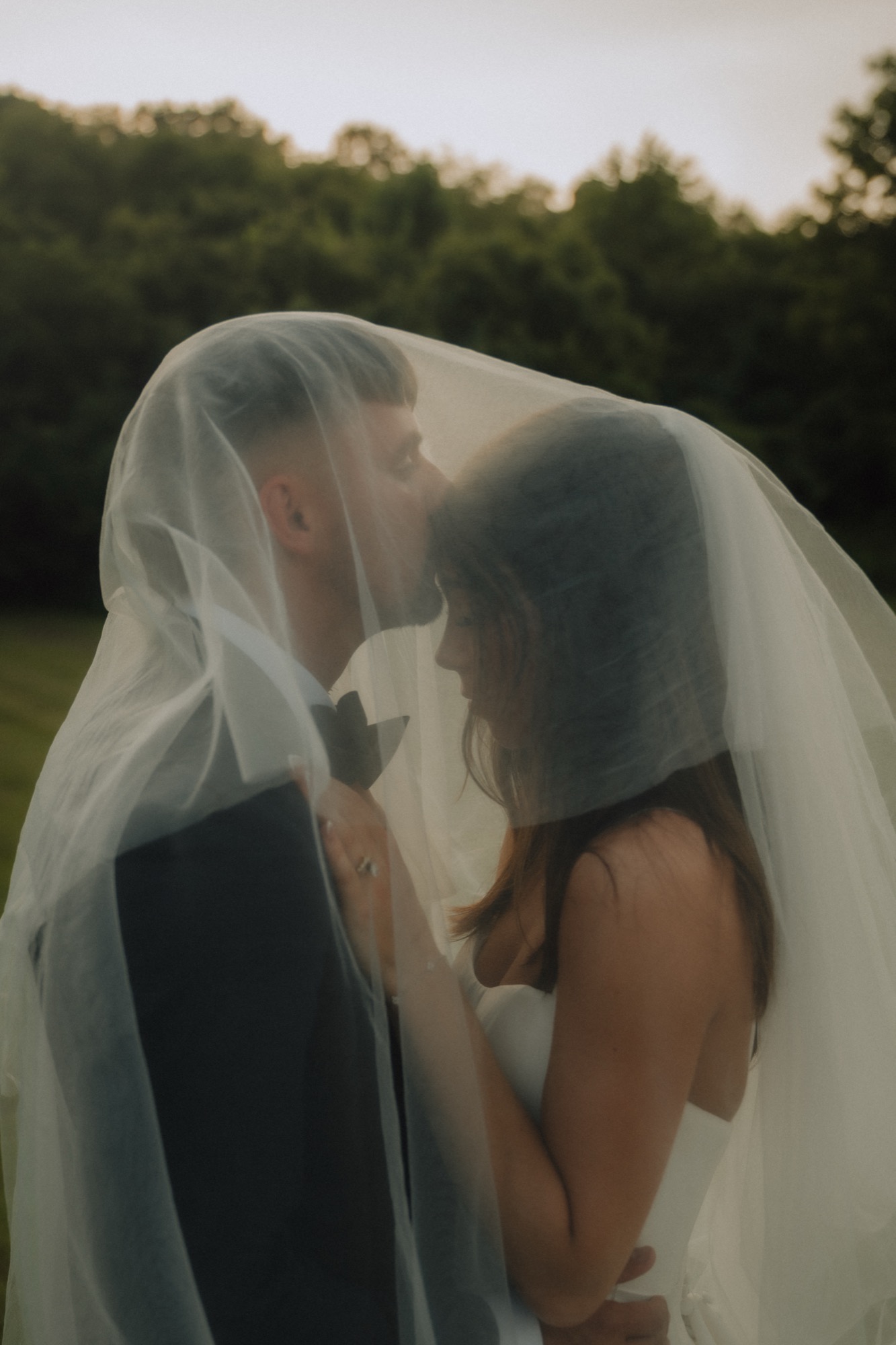 The two of them beneath her veil
